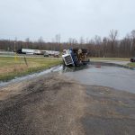 Fertilizer truck overturns- stinky clean-up