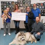 100+ Women Who Care donate nearly $11K to Helping Paws