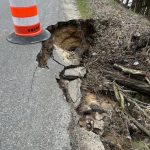 Rain and snow washout a Lawrence Township street