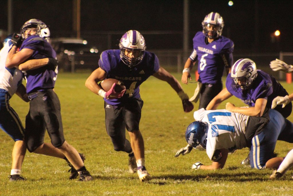 Three Rivers junior running back Jace Gray (24) rushes through a hole in the defense during Friday’s Homecoming win over Plainwell.