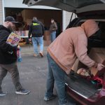 Lions Club, volunteers serve community with annual food, toy distribution