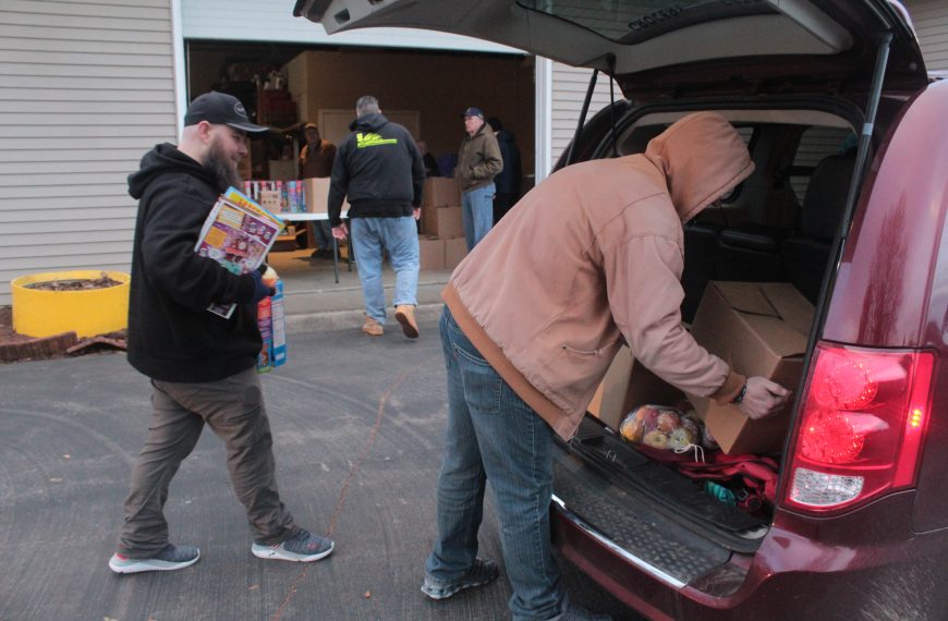 Lions Club, volunteers serve community with annual food, toy distribution